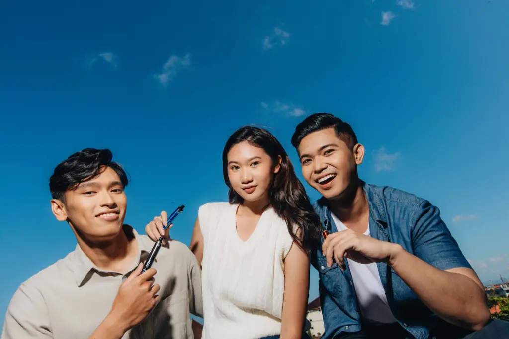 three model smiling with clear blue sky