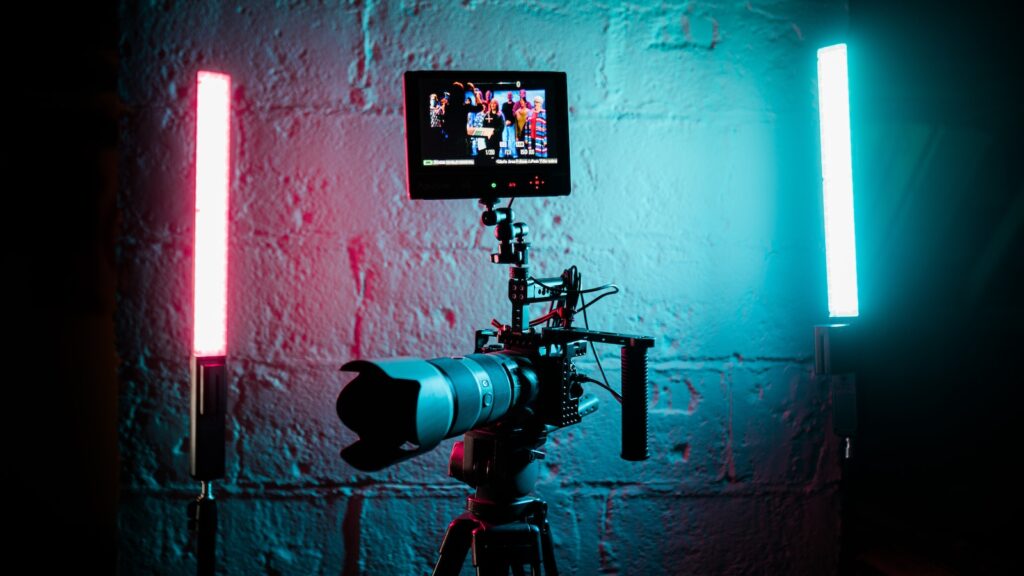 a camera set up in front of a brick wall